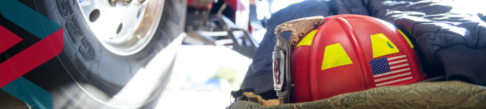 image showing tire of fire truck and helmet on the ground